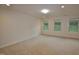Spacious carpeted bedroom with three windows offering ample natural light at 536 Rockcastle Dr, Cary, NC 27519