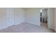 Neutral bedroom with plush carpeting, two closets, and convenient access to the adjacent bathroom at 536 Rockcastle Dr, Cary, NC 27519