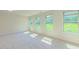 Spacious bonus room featuring multiple windows with views of the outdoors at 536 Rockcastle Dr, Cary, NC 27519