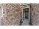 Close-up of the home's front exterior featuring brick detailing, the front door, and house number at 536 Rockcastle Dr, Cary, NC 27519