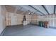 Clean, two-car garage with finished walls, epoxy flooring and ample storage space at 536 Rockcastle Dr, Cary, NC 27519