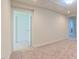 Upstairs hallway with neutral carpet and white trim at 536 Rockcastle Dr, Cary, NC 27519