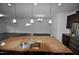 Open-concept kitchen with an island, stainless appliances and seamlessly flows into the adjacent living spaces at 536 Rockcastle Dr, Cary, NC 27519