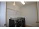 Laundry room featuring side-by-side Samsung washer and dryer and wire shelving at 536 Rockcastle Dr, Cary, NC 27519