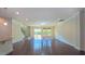 Bright living room featuring hardwood floors, large windows, and glass sliding doors providing lots of natural light at 536 Rockcastle Dr, Cary, NC 27519