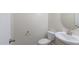 A clean and modern powder room features a white sink and toilet, with neutral wall color and modern fixtures at 536 Rockcastle Dr, Cary, NC 27519