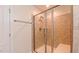 Shower with tiled walls, built-in bench seating, and a sleek glass door at 536 Rockcastle Dr, Cary, NC 27519