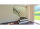 Elegant staircase with decorative wrought iron railing and hardwood treads leads to the upper level at 536 Rockcastle Dr, Cary, NC 27519