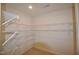 Walk-in closet featuring multiple shelves for optimized storage space at 536 Rockcastle Dr, Cary, NC 27519