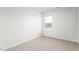 Bright bedroom with a window overlooking green trees at 5556 Henley Ridge Dr, Graham, NC 27253