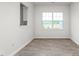 Dining room with wood-look floors and a view of the green space outside at 5556 Henley Ridge Dr, Graham, NC 27253
