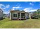 Exterior view of the home showing a well-kept lawn, simple landscaping, and adjacent homes in the neighborhood at 601 Minerva Dale Dr, Fuquay Varina, NC 27526