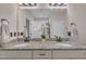 Bright bathroom features granite counters, dual sinks, white cabinets, and a decorative floral arrangement at 601 Minerva Dale Dr, Fuquay Varina, NC 27526
