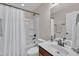 Bathroom featuring a single sink vanity, shower/tub combo, and neutral walls at 601 Minerva Dale Dr, Fuquay Varina, NC 27526
