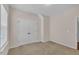 Bedroom featuring neutral walls, carpeted floors, and a double door closet at 601 Minerva Dale Dr, Fuquay Varina, NC 27526