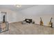 Large bonus room features carpeted floors, a futon, and ample space at 601 Minerva Dale Dr, Fuquay Varina, NC 27526