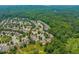 Scenic aerial view of a residential neighborhood surrounded by lush green trees and nature at 606 Corrigan Way, Cary, NC 27519