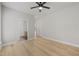A clean and spacious bedroom with hardwood floors and an en-suite bathroom at 606 Corrigan Way, Cary, NC 27519