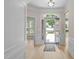 Bright foyer with hardwood floors, an arched entryway, and a decorative light fixture at 606 Corrigan Way, Cary, NC 27519
