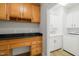 Laundry room with cabinetry, counter space, and sink at 606 Corrigan Way, Cary, NC 27519