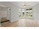 Bright living room with large windows and light wood flooring at 606 Corrigan Way, Cary, NC 27519