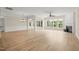 Expansive living area with hardwood floors, a fireplace, and plenty of natural light at 606 Corrigan Way, Cary, NC 27519