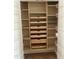 Walk-in pantry featuring wood shelves, drawers, and wire basket storage at 606 Corrigan Way, Cary, NC 27519