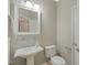 Classic powder room with pedestal sink, mirror and neutral paint at 606 Corrigan Way, Cary, NC 27519