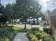 A quiet street view showcases lush landscaping and well-maintained homes with manicured lawns and mature trees at 606 Corrigan Way, Cary, NC 27519