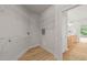 Spacious walk-in closet with wire shelving, hardwood floor and view to bathroom at 606 Corrigan Way, Cary, NC 27519