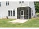 A screened porch and concrete patio extend to a level and sunny backyard at 617 Woodson Dr, Clayton, NC 27527