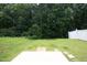 A well-maintained yard includes a concrete patio and grassy area, perfect for outdoor activities at 617 Woodson Dr, Clayton, NC 27527