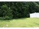 The fenced backyard boasts lush greenery and offers a private, serene outdoor space at 617 Woodson Dr, Clayton, NC 27527