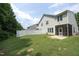 A spacious backyard features a pristine white fence, offering privacy and curb appeal at 617 Woodson Dr, Clayton, NC 27527