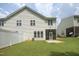 A large backyard with a screened porch that provides a relaxing outdoor space at 617 Woodson Dr, Clayton, NC 27527