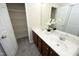 Bathroom with double sinks, large mirror, and open door to closet at 617 Woodson Dr, Clayton, NC 27527