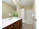 Bright bathroom with a single sink vanity, granite countertops, and a combination bathtub and shower at 617 Woodson Dr, Clayton, NC 27527