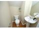 Compact bathroom featuring a sink, toilet, and modern fixtures at 617 Woodson Dr, Clayton, NC 27527
