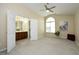 Spacious bedroom with neutral walls, ceiling fan, and natural light coming through a large arched window at 617 Woodson Dr, Clayton, NC 27527
