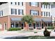 Charming commercial building featuring brick accents, awnings, benches, and accessible parking in Clayton at 617 Woodson Dr, Clayton, NC 27527
