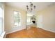 Inviting dining room featuring hardwood floors and a decorative chandelier at 617 Woodson Dr, Clayton, NC 27527