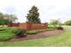 A beautifully landscaped brick entrance to the Riverwood Athletic Club welcomes residents and guests at 617 Woodson Dr, Clayton, NC 27527