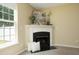 Cozy fireplace with decorative mantel and accent lighting at 617 Woodson Dr, Clayton, NC 27527