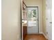 Inviting foyer with hardwood floors, neutral walls, a red front door and a view to the exterior at 617 Woodson Dr, Clayton, NC 27527