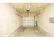 A two car garage with painted walls is ready for your vehicles or storage at 617 Woodson Dr, Clayton, NC 27527