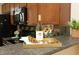 Well-lit kitchen featuring stainless steel appliances and decorative backsplash at 617 Woodson Dr, Clayton, NC 27527