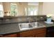 A stylish kitchen with bar seating and updated features for dining and cooking at 617 Woodson Dr, Clayton, NC 27527