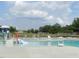 The community pool has plenty of lounge chairs and a slide for cooling off in the summer at 617 Woodson Dr, Clayton, NC 27527