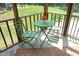 Screened porch featuring outdoor green furniture, a table and natural light at 617 Woodson Dr, Clayton, NC 27527
