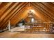 Unfinished attic with exposed wooden rafters, duct work and unfinished floor at 6201 King Croydon Ct Ct, Raleigh, NC 27603
